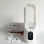 Portable cooling humidifier fan on desk