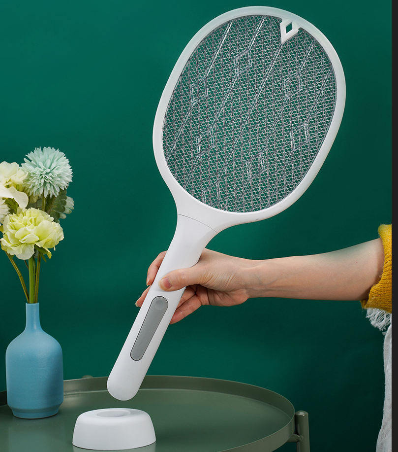 User holding lightweight mosquito swatter racket