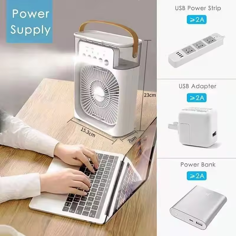 White desktop fan with mist on office desk