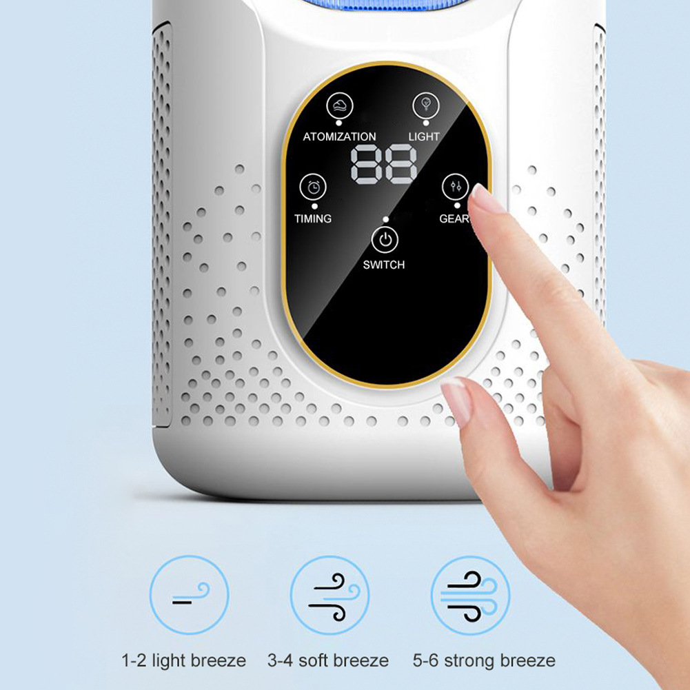 Portable cooling humidifier fan on desk