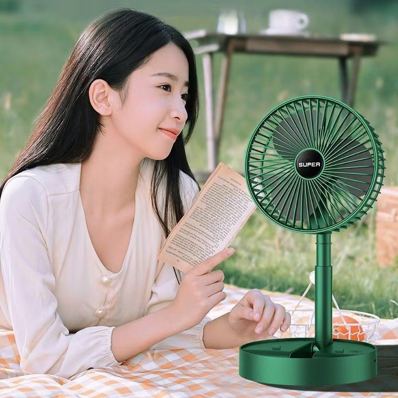 Foldable USB fan placed on office desk for quiet cooling