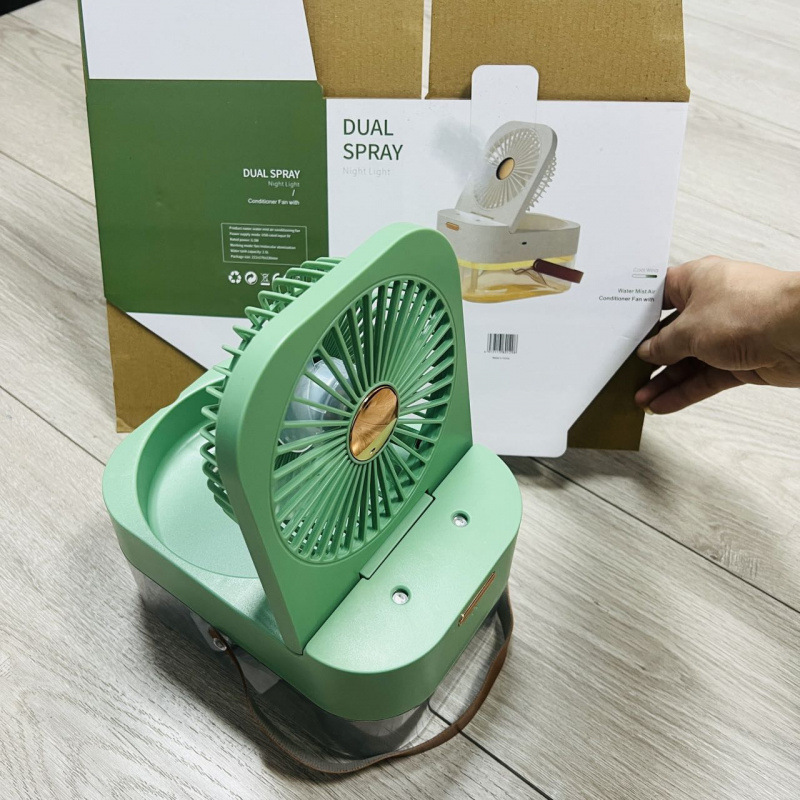 USB desktop humidifier fan in modern office workspace